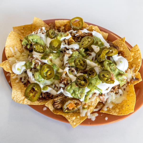 Taqueria El Sombrero's nachos loaded with meat, melted cheese, guacamole, sour cream, and jalapeños.