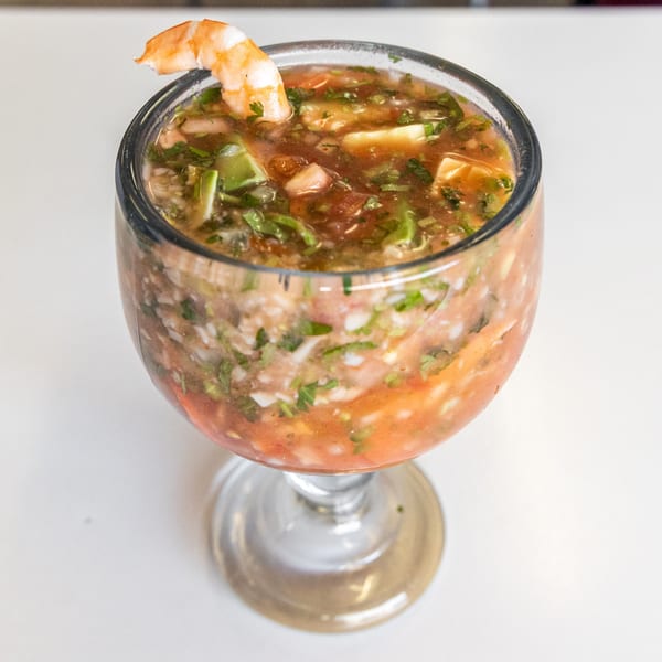 Shrimp cocktail in a goblet, garnished with a single shrimp, from Taqueria El Sombrero.